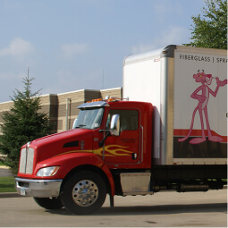 Red semi trailer for hauling insulation