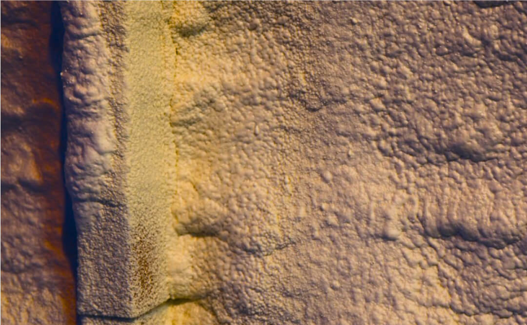 Close-up of spray foam on wall