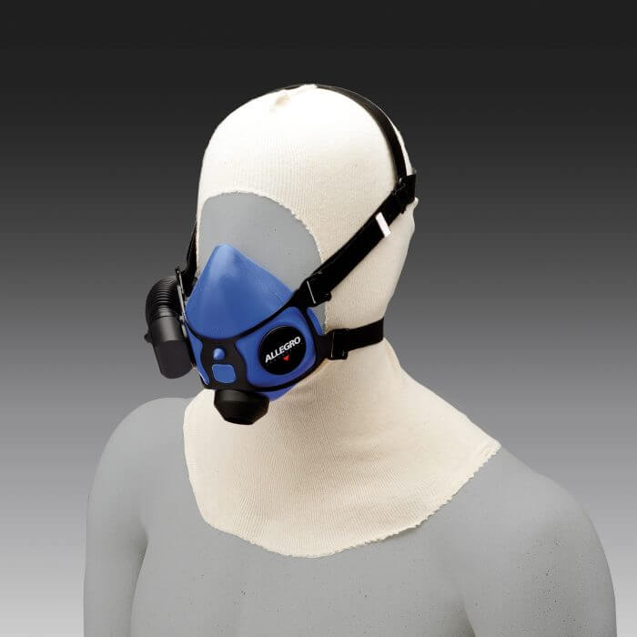 A blue and black respirator mask over a mannequin.