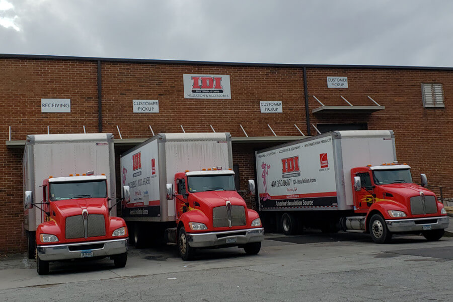 Three semi trucks parked at IDI loading bay in Atlanta, GA