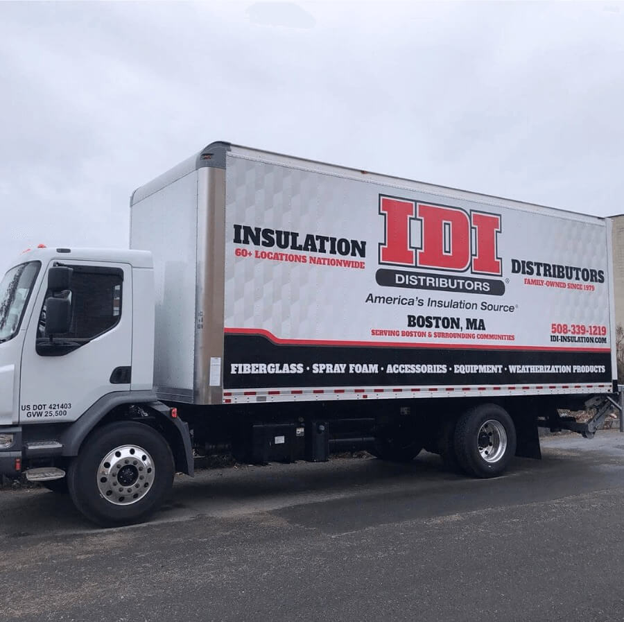 A white IDI Distributors semi truck.