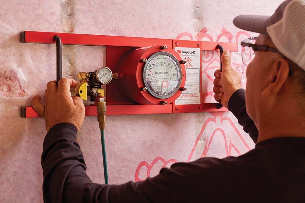 Technician working on dial of red Inspect-R