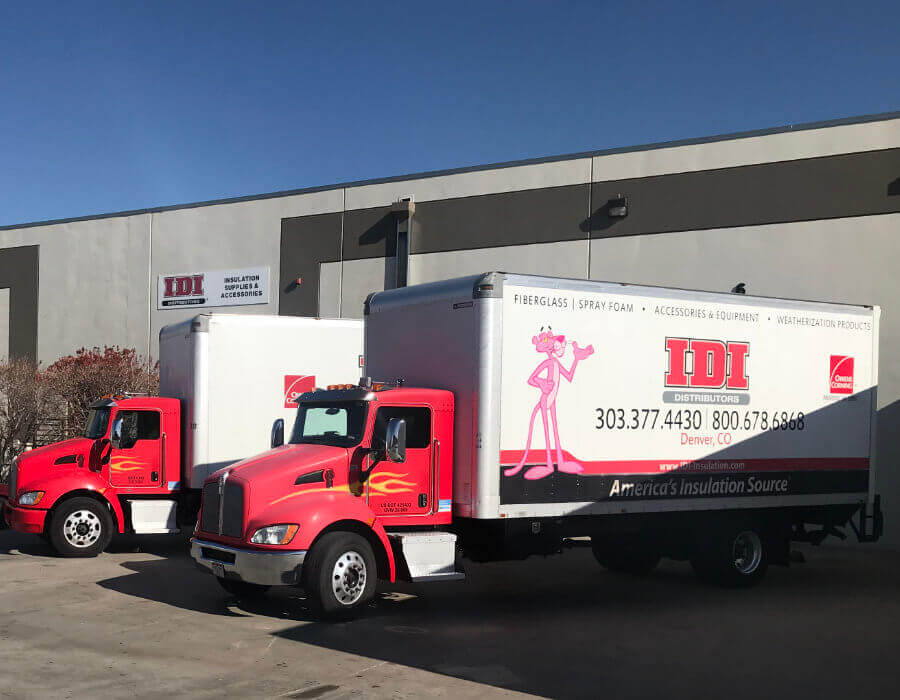 Wide view of IDI's Denver location with two trucks out front