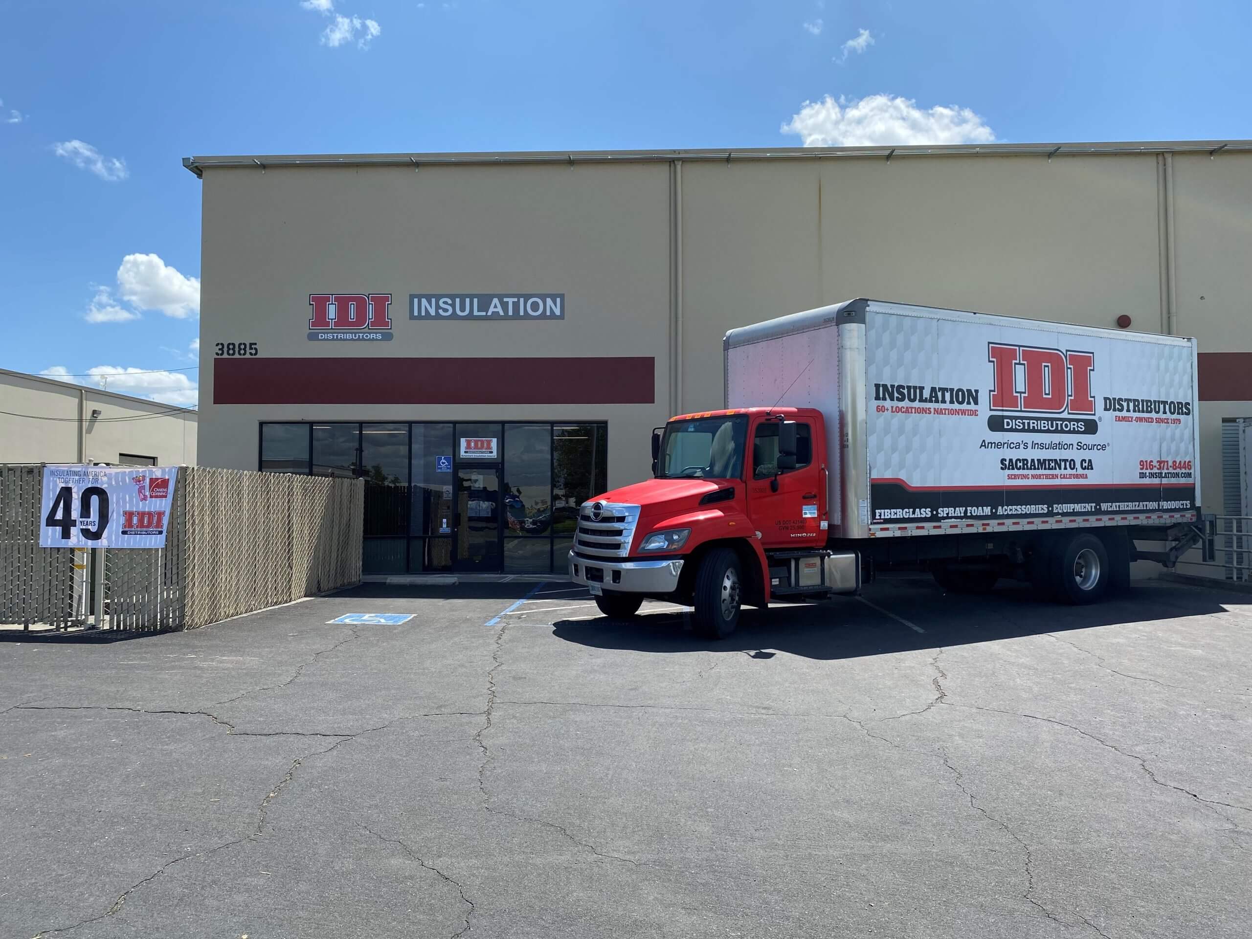 Outside view of IDI Insulation building with IDI Insulation truck