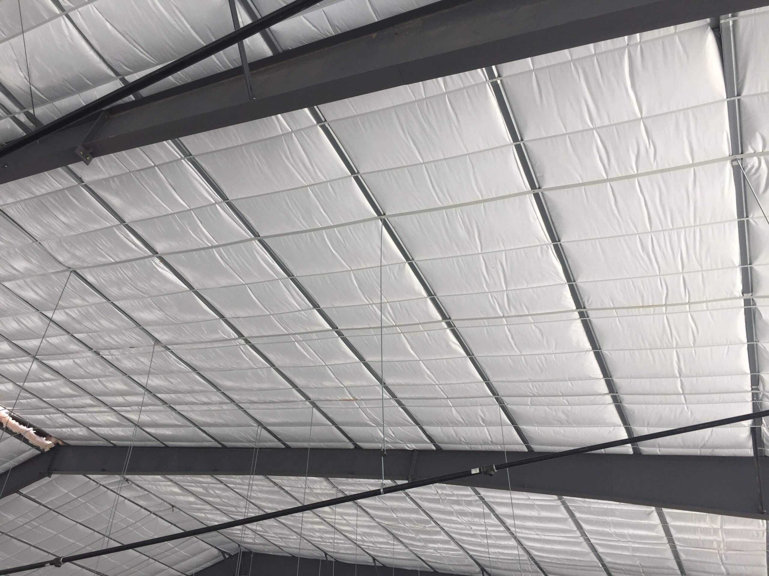 long tab banded insulation system installed in metal building