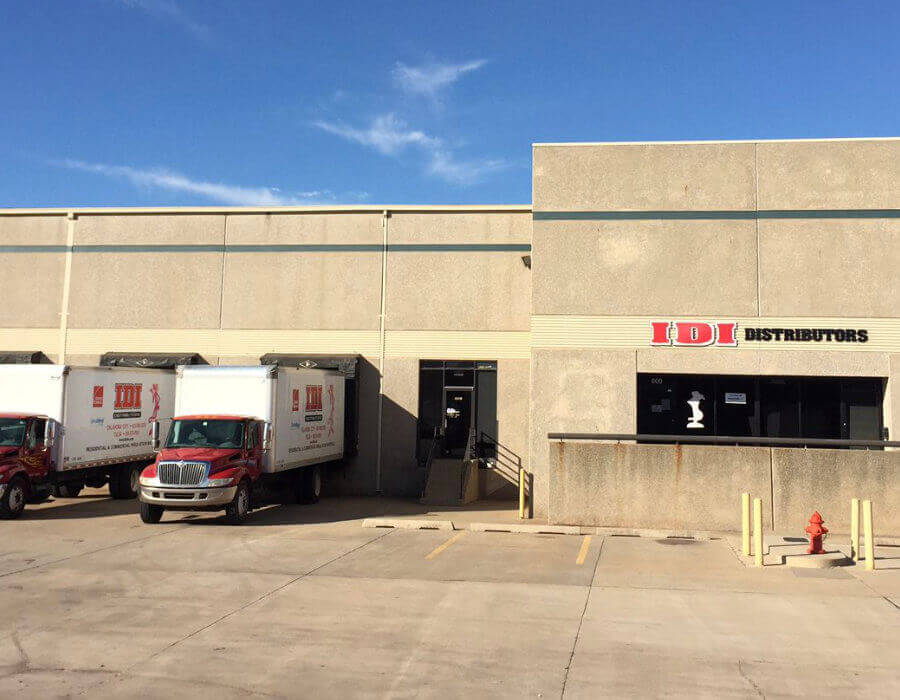 Two IDI trucks parked outside of IDI's OKC branch