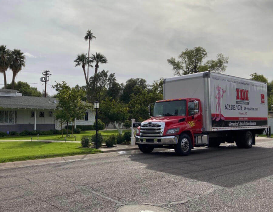 Phoenix, AZ IDI semi parked in front of lush green lawn