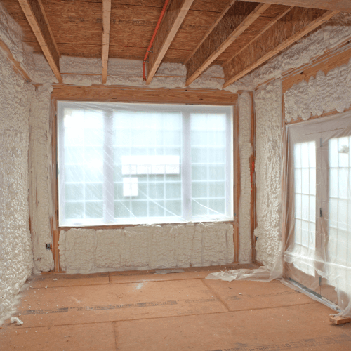 Unfinished home interior featuring spray insulation