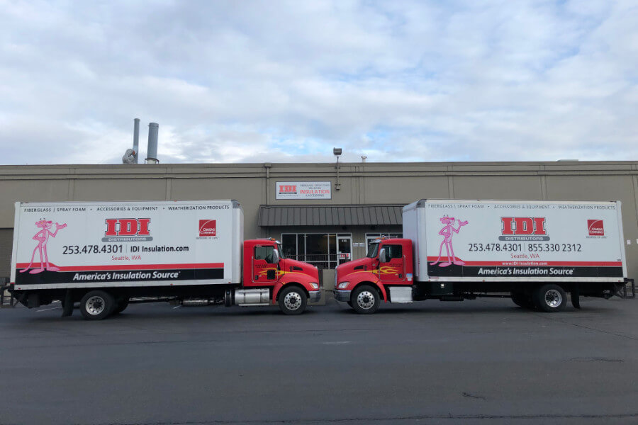 Two semis parked bumper to bumper in front of Tacoma, WA IDI