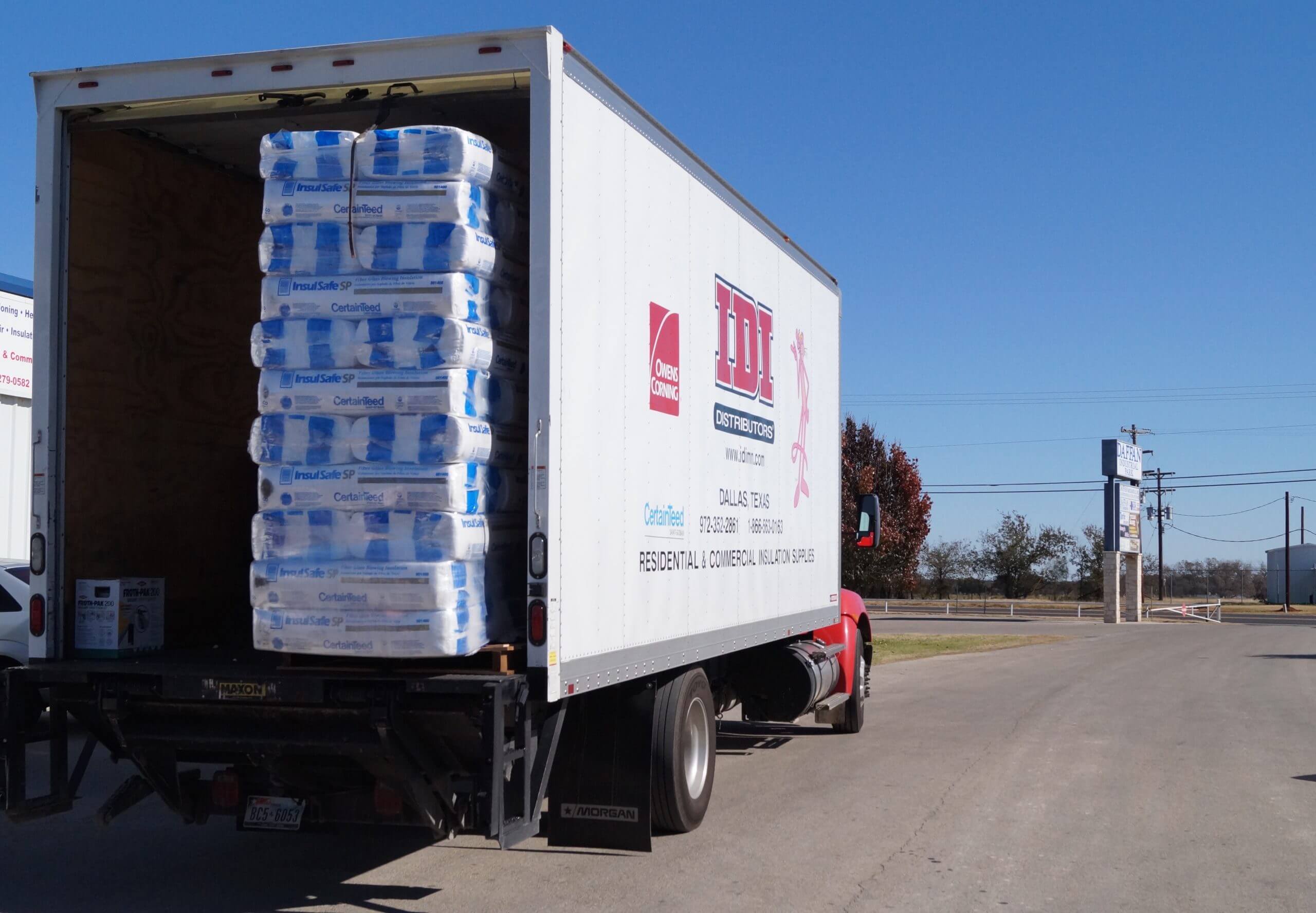 stack of CertainTeed fiber blowing glass inside IDI distributors Dallas Tx truck