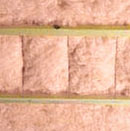 Insulation supports holding pink insulation in place