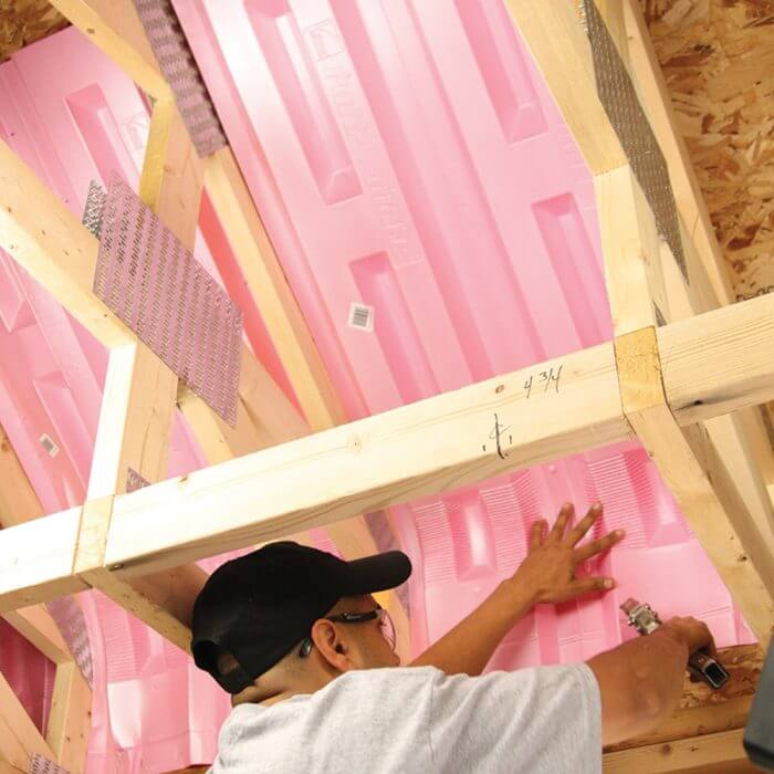 Man installing raft-R-Mate foam board