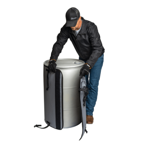 Man wrapping drum in sidewinder drum heater