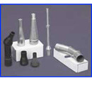 Set of six wall nozzles, 3 black plastic and 3 metal, used for spray foam insulation