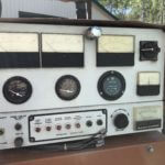 White radio machinery with black knobs