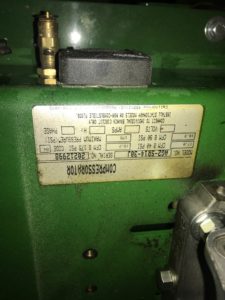 Blurry label on green piece of machinery