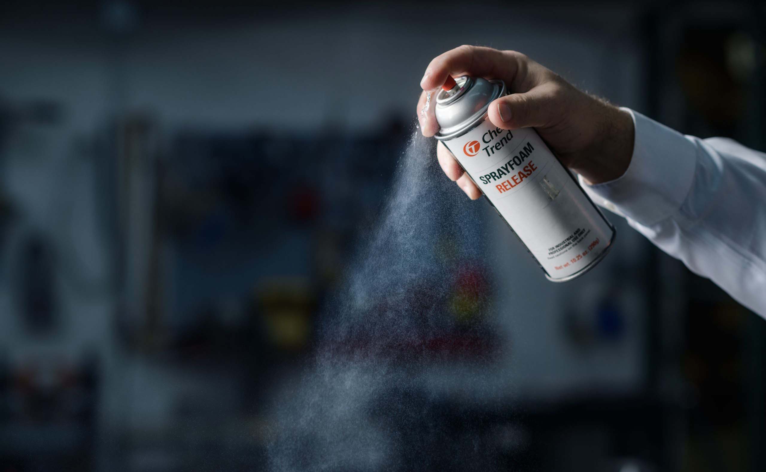 Stylized shot of person spraying Sprayfoam Release