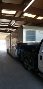 Poorly lit photograph of storage trailer interior