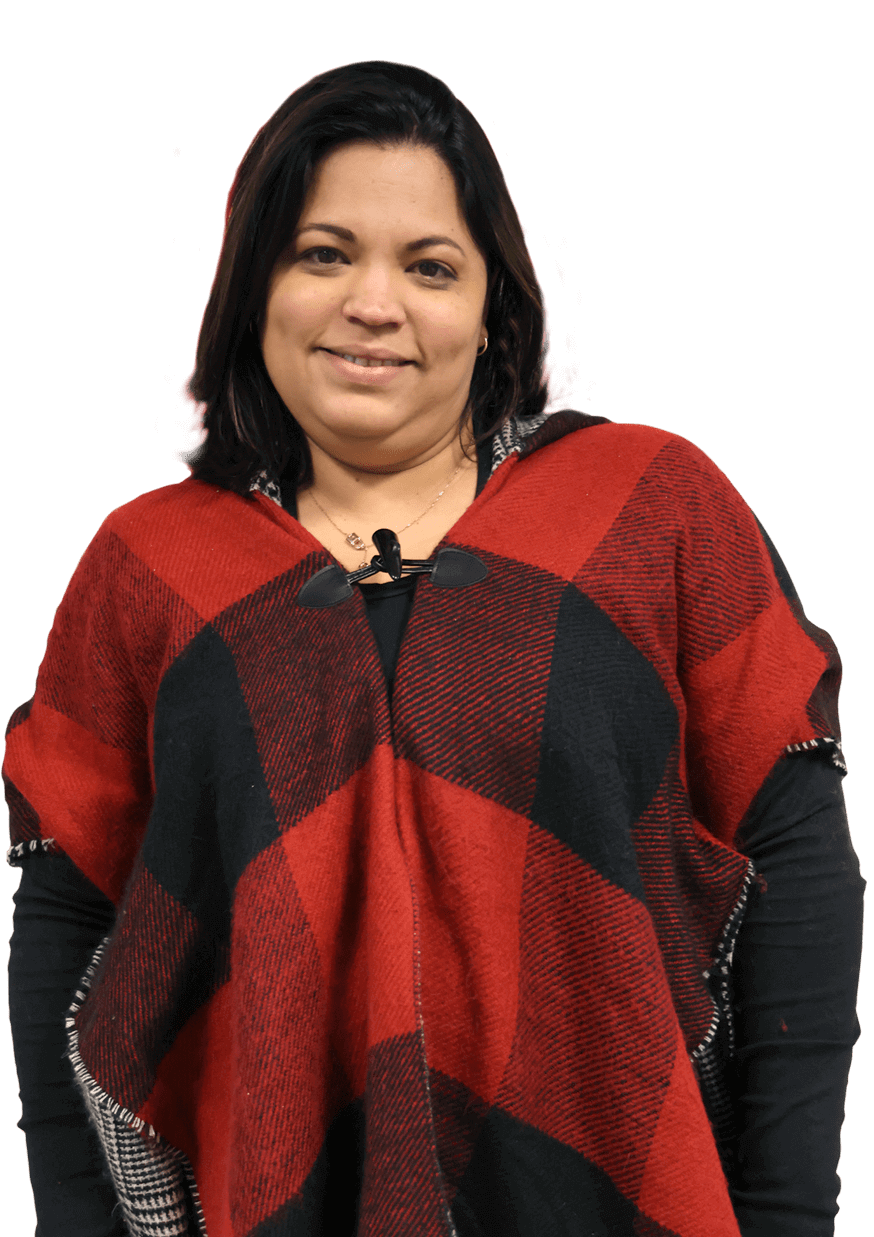 Woman standing upright in black and red poncho