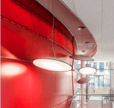 Abstract photograph of lights and red paneling in room