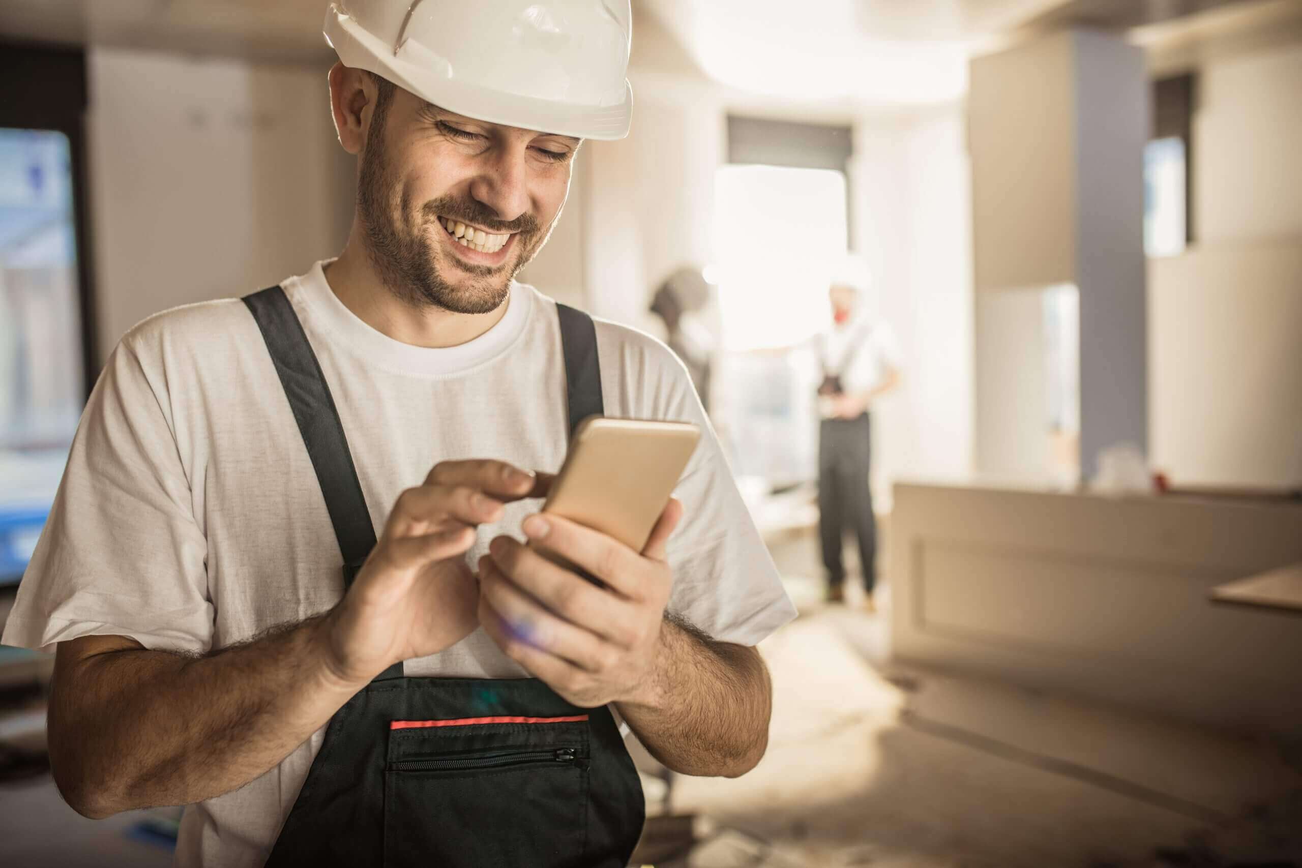 Worker looking at his phone