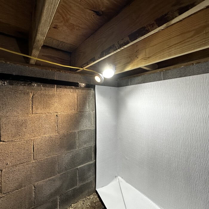 A photo of a crawlspace where Viper Double Bond Tape is applied and Viper Pins