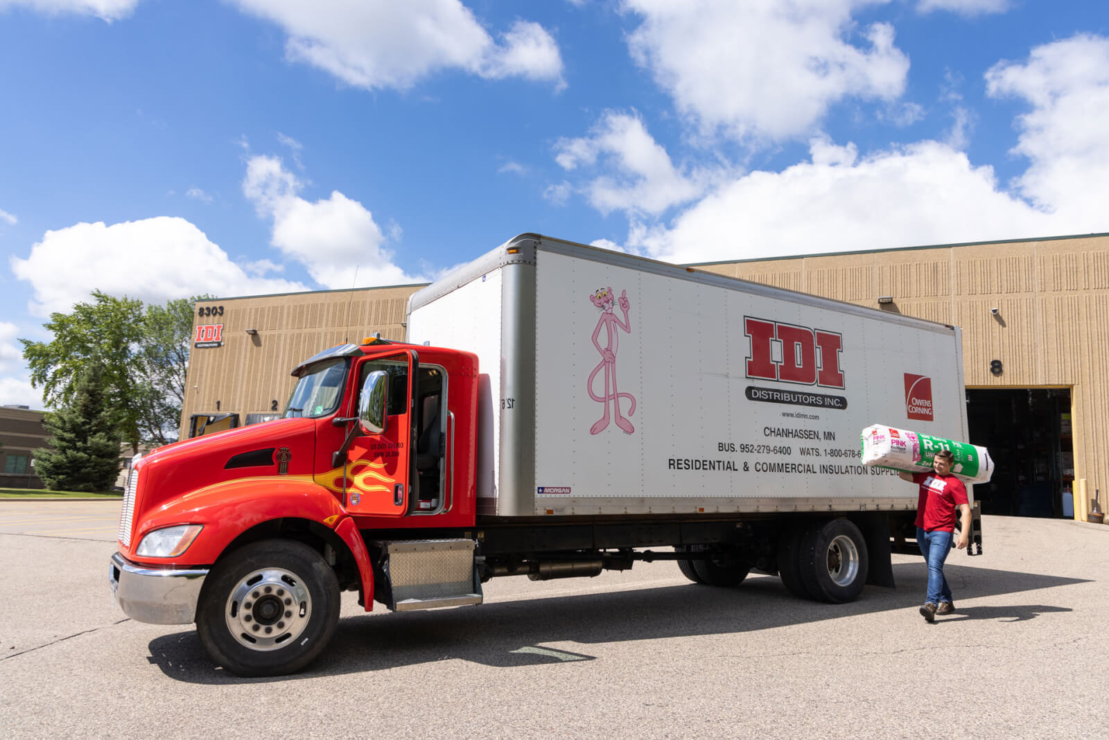 IDI semi truck with fire decal on drivers door & pink panther on body