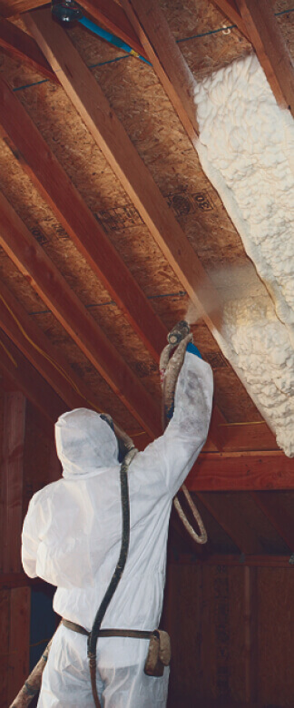 IDI technician installing spray foam